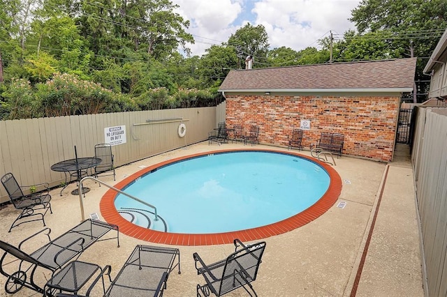 view of pool featuring a patio