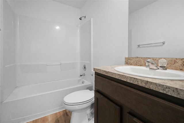 full bathroom with hardwood / wood-style flooring, vanity, toilet, and tub / shower combination