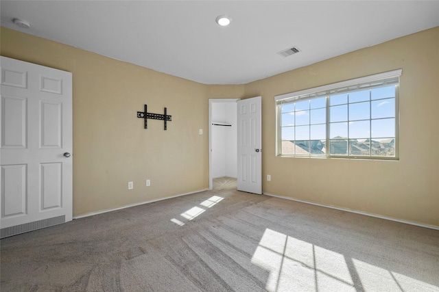 unfurnished bedroom with light carpet