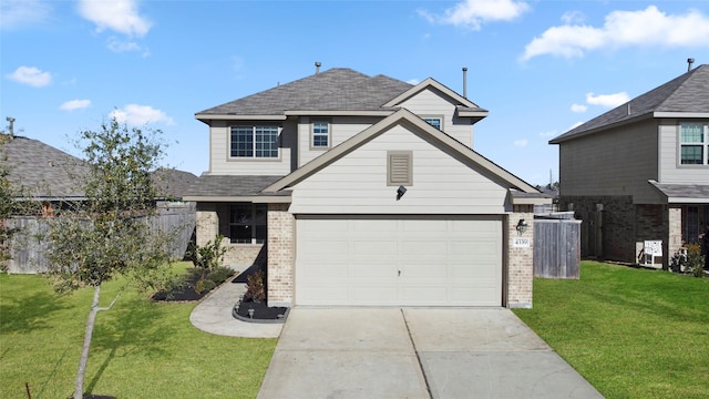 view of property featuring a garage and a front yard