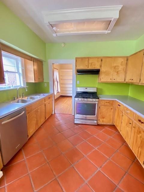 kitchen featuring sink, light tile patterned floors, and appliances with stainless steel finishes