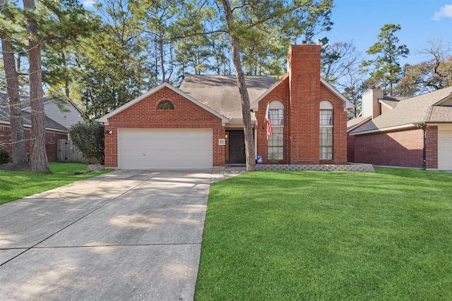 view of front of property featuring a garage and a front yard