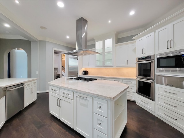 kitchen featuring white cabinetry, a center island, appliances with stainless steel finishes, island exhaust hood, and light stone countertops