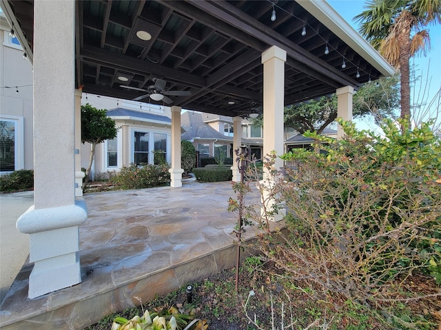 view of patio featuring ceiling fan