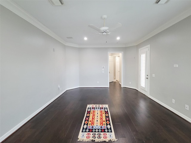 empty room featuring crown molding, dark hardwood / wood-style floors, and ceiling fan