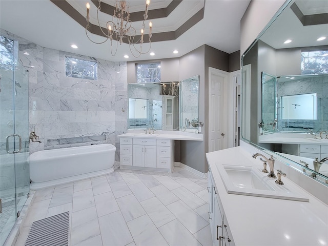 bathroom with plus walk in shower, tile walls, vanity, a raised ceiling, and crown molding