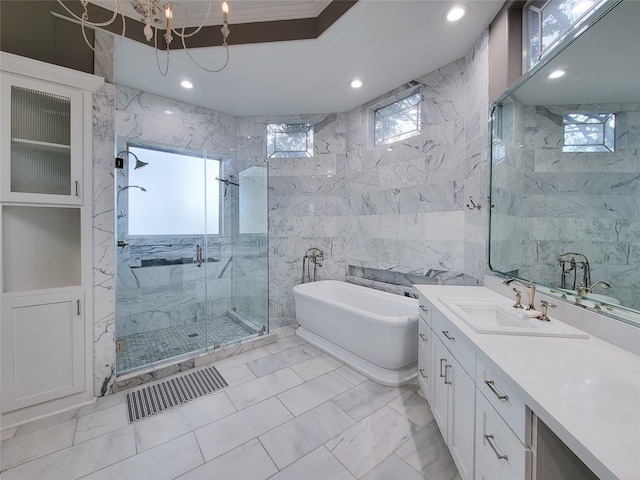 bathroom with vanity, plus walk in shower, and tile walls