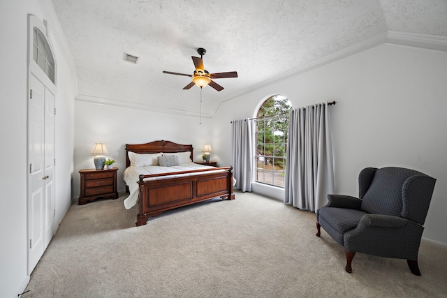 bedroom with light carpet, lofted ceiling, visible vents, and a textured ceiling