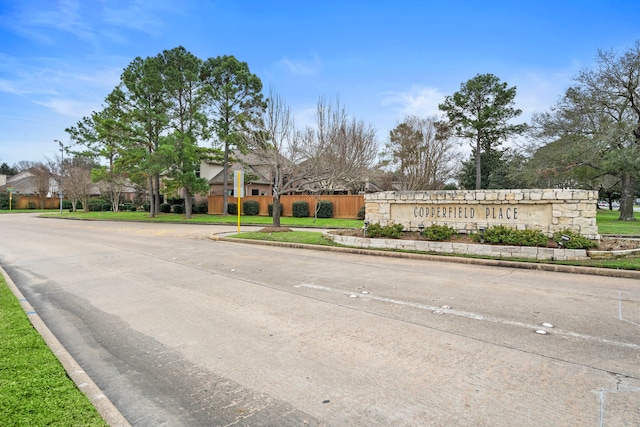 view of street with curbs