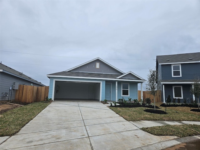 view of front of home with a garage and a front lawn