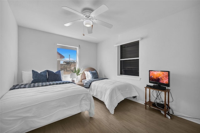 bedroom featuring dark wood-type flooring and ceiling fan