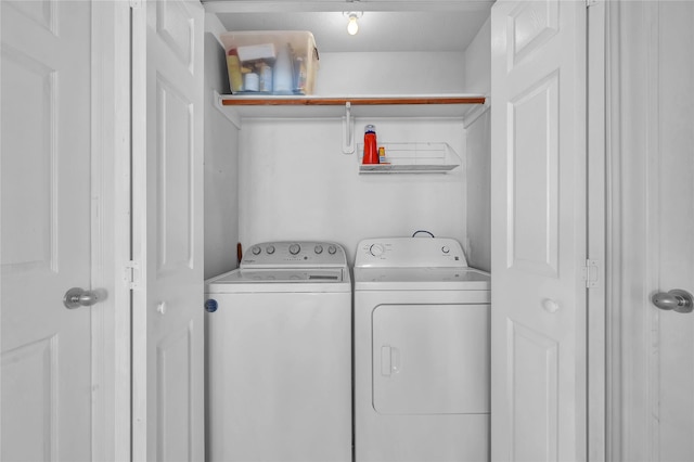 clothes washing area featuring washing machine and clothes dryer