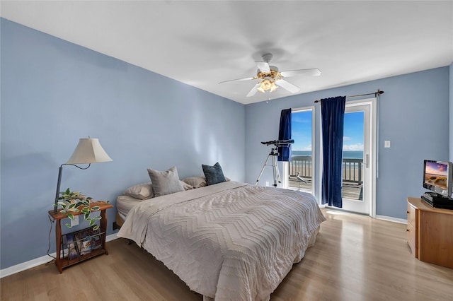 bedroom with access to outside, ceiling fan, and light hardwood / wood-style flooring