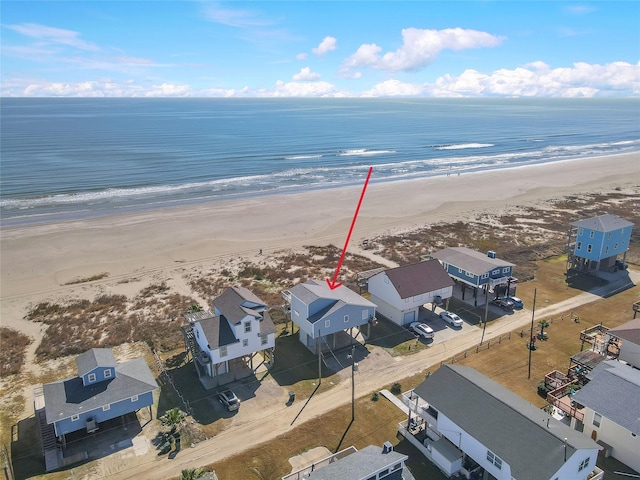 aerial view with a beach view and a water view