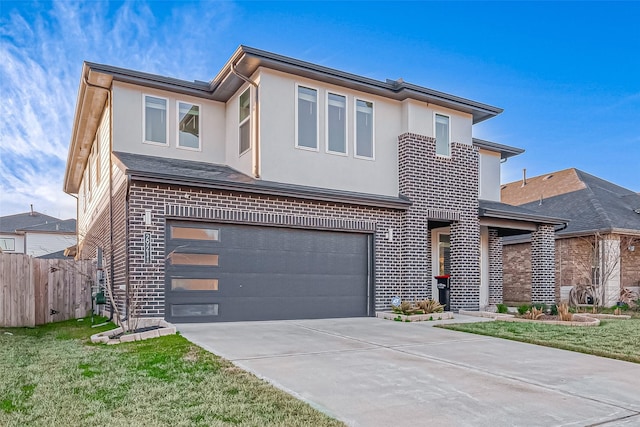 contemporary house featuring a garage and a front lawn