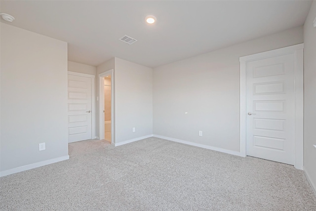 empty room with carpet flooring