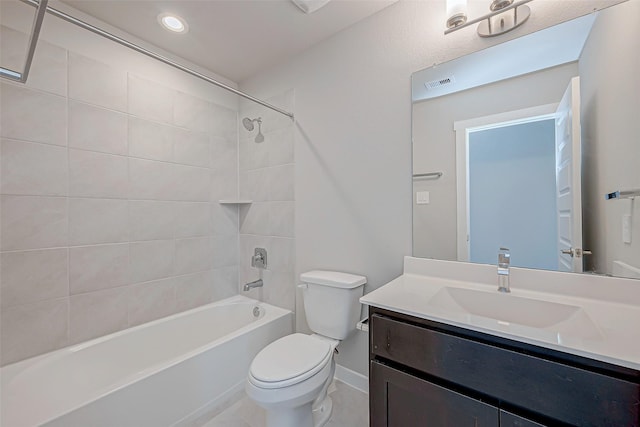 full bathroom with vanity, toilet, and tiled shower / bath