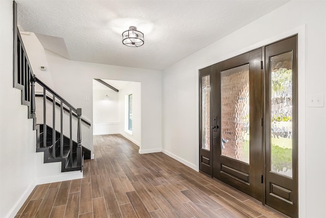 entrance foyer with a textured ceiling