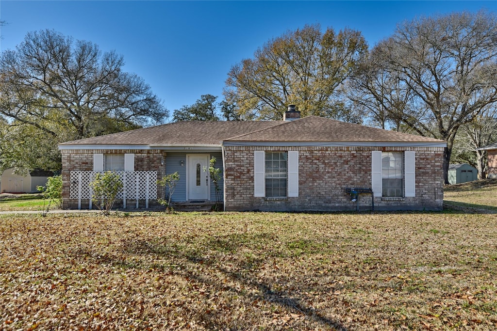 ranch-style house with a front yard