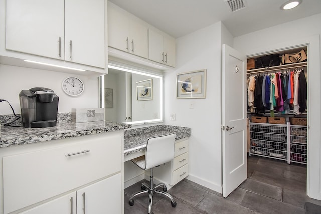 tiled home office featuring built in desk