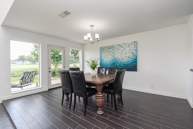 dining area with an inviting chandelier