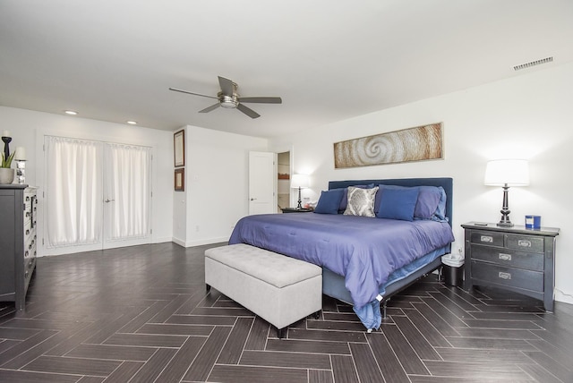 bedroom featuring ceiling fan and dark parquet floors