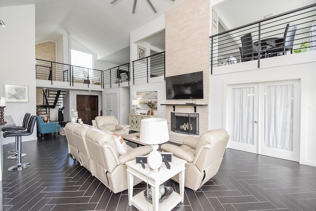 living room with dark parquet floors and high vaulted ceiling