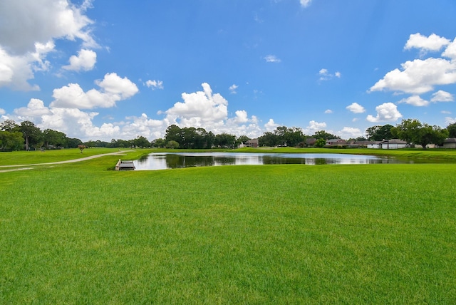 exterior space with a yard and a water view