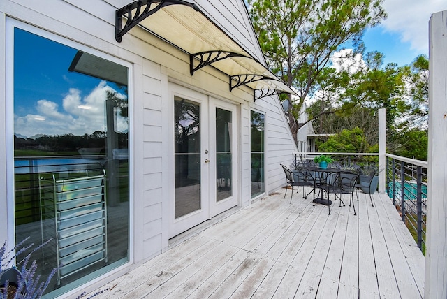 wooden terrace featuring french doors