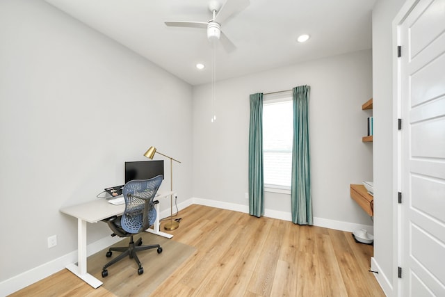 office space featuring ceiling fan and light hardwood / wood-style flooring