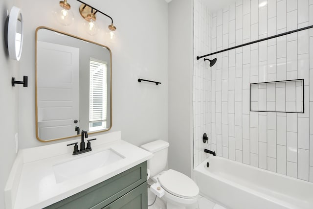 full bathroom featuring vanity, toilet, and tiled shower / bath