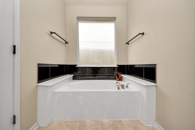 bathroom featuring tile patterned floors and a bathtub