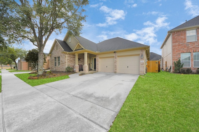 view of front of house with a garage and a front yard