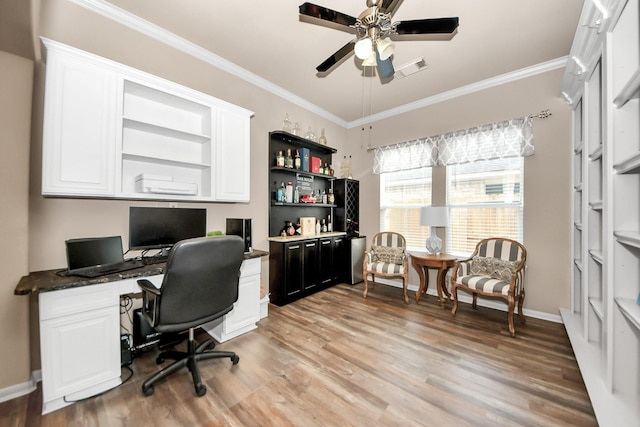 home office with crown molding, light hardwood / wood-style floors, and ceiling fan