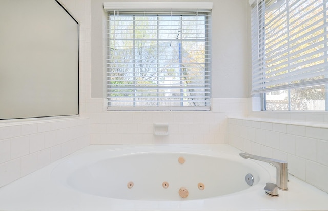 bathroom with a whirlpool tub