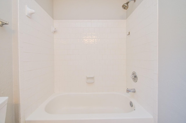 bathroom with toilet and washtub / shower combination