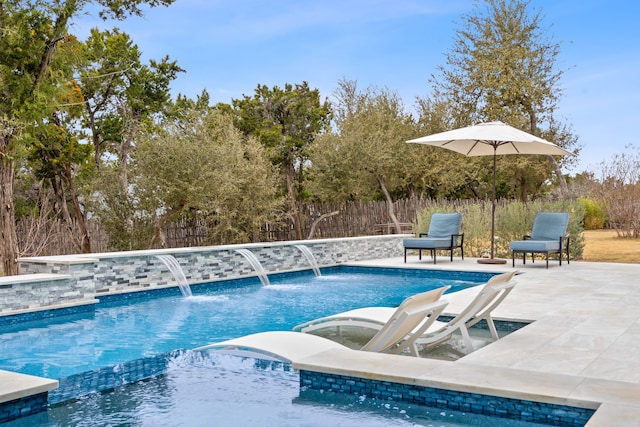 view of swimming pool featuring a hot tub, a patio, and pool water feature