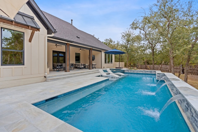 view of pool with pool water feature, ceiling fan, an in ground hot tub, and a patio