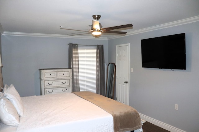 bedroom with crown molding, dark wood-type flooring, and ceiling fan