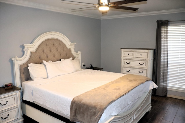 bedroom featuring ornamental molding, dark hardwood / wood-style floors, and ceiling fan