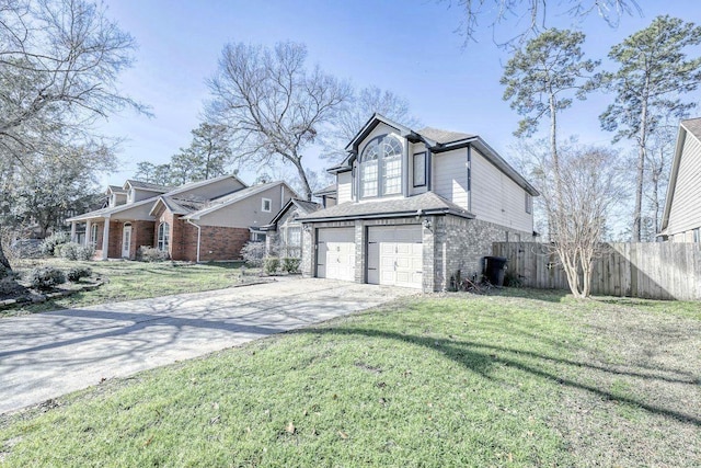 view of front of house with a garage, brick siding, fence, driveway, and a front yard