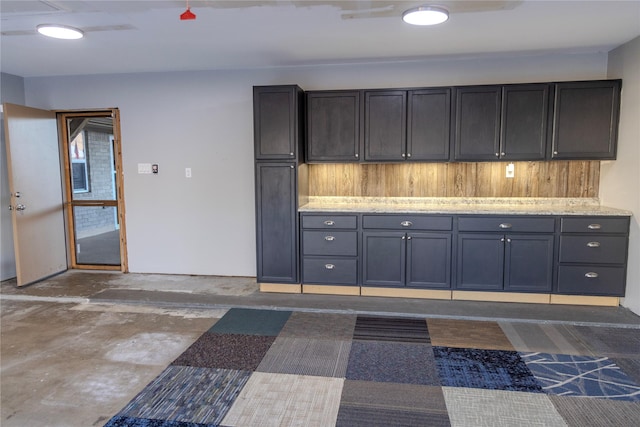 kitchen featuring light stone counters