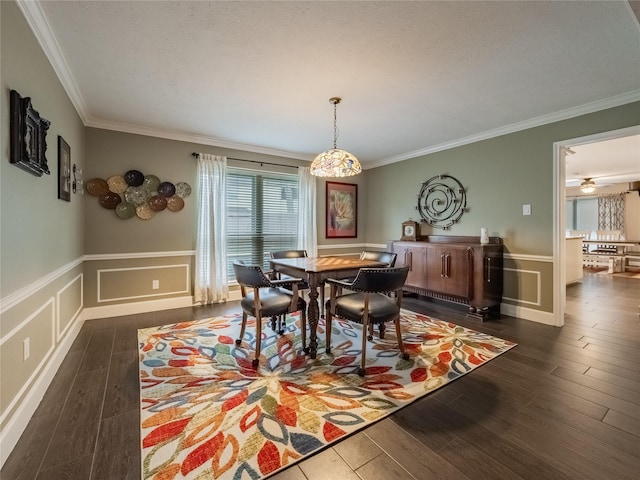 dining room featuring crown molding and dark wood-type flooring