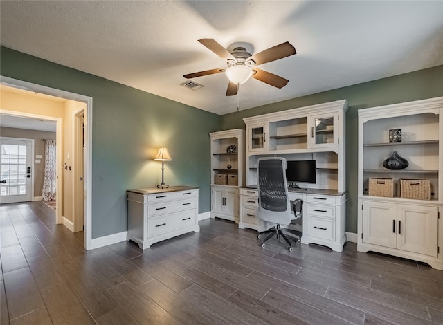 office area featuring ceiling fan and dark hardwood / wood-style flooring