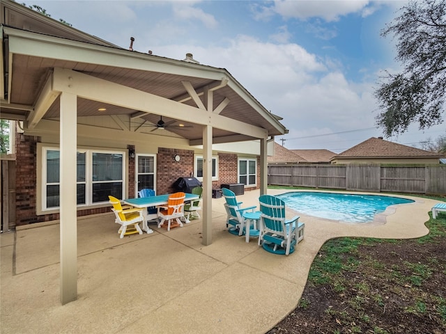 view of pool featuring ceiling fan and a patio area