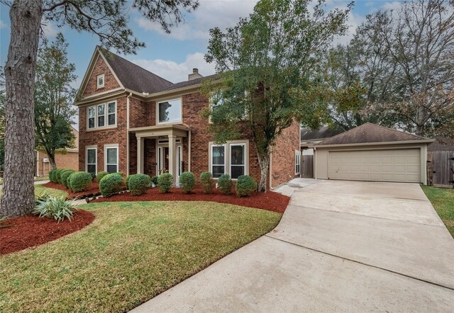 view of front facade featuring a garage and a front yard