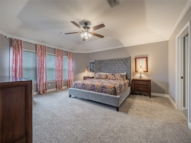 carpeted bedroom featuring ornamental molding and ceiling fan