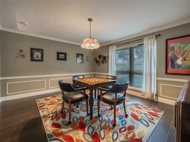 dining space featuring dark hardwood / wood-style flooring and crown molding