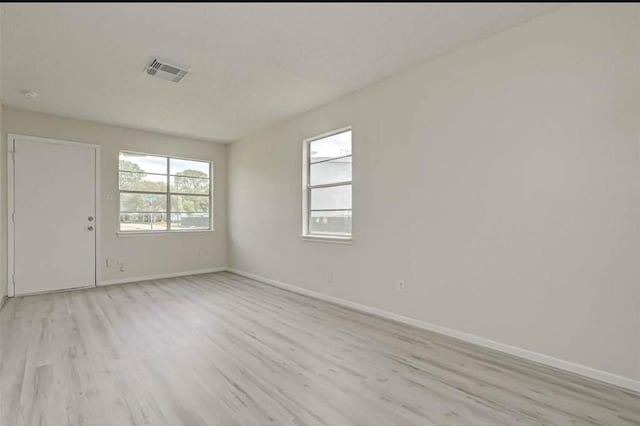 unfurnished room featuring light hardwood / wood-style flooring