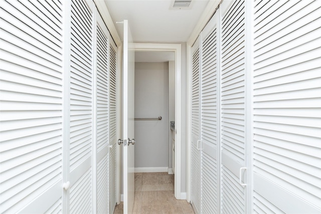 hallway with light tile patterned flooring